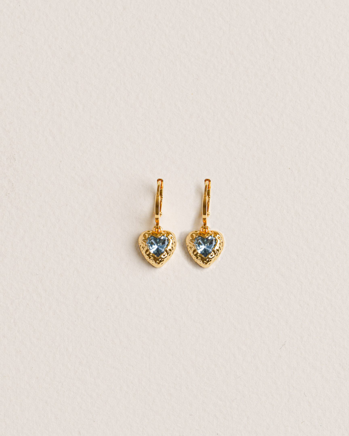Heart-shaped earrings with blue gemstones