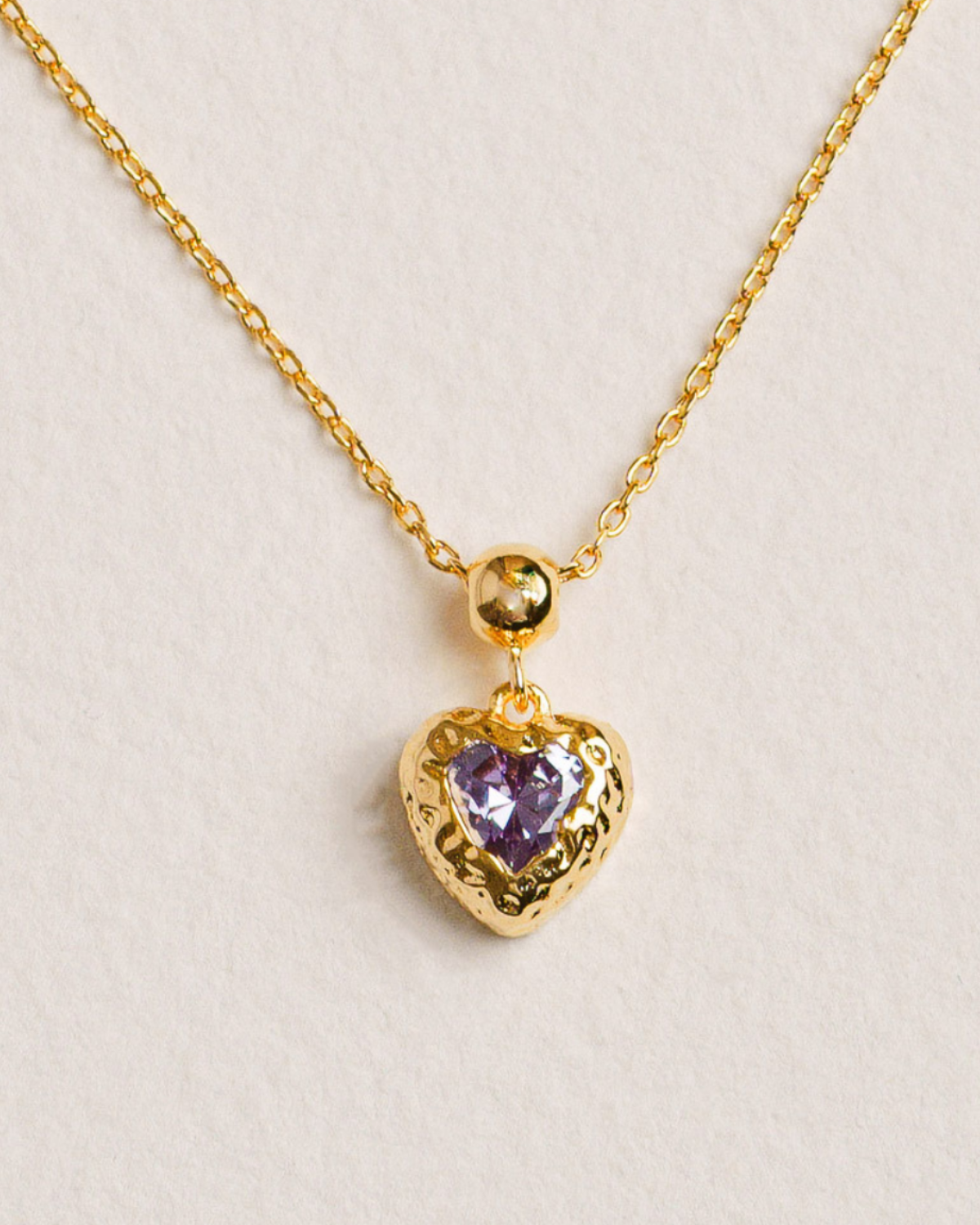 18K Gold-plated necklace with a heart-shaped pendant featuring a purple gemstone