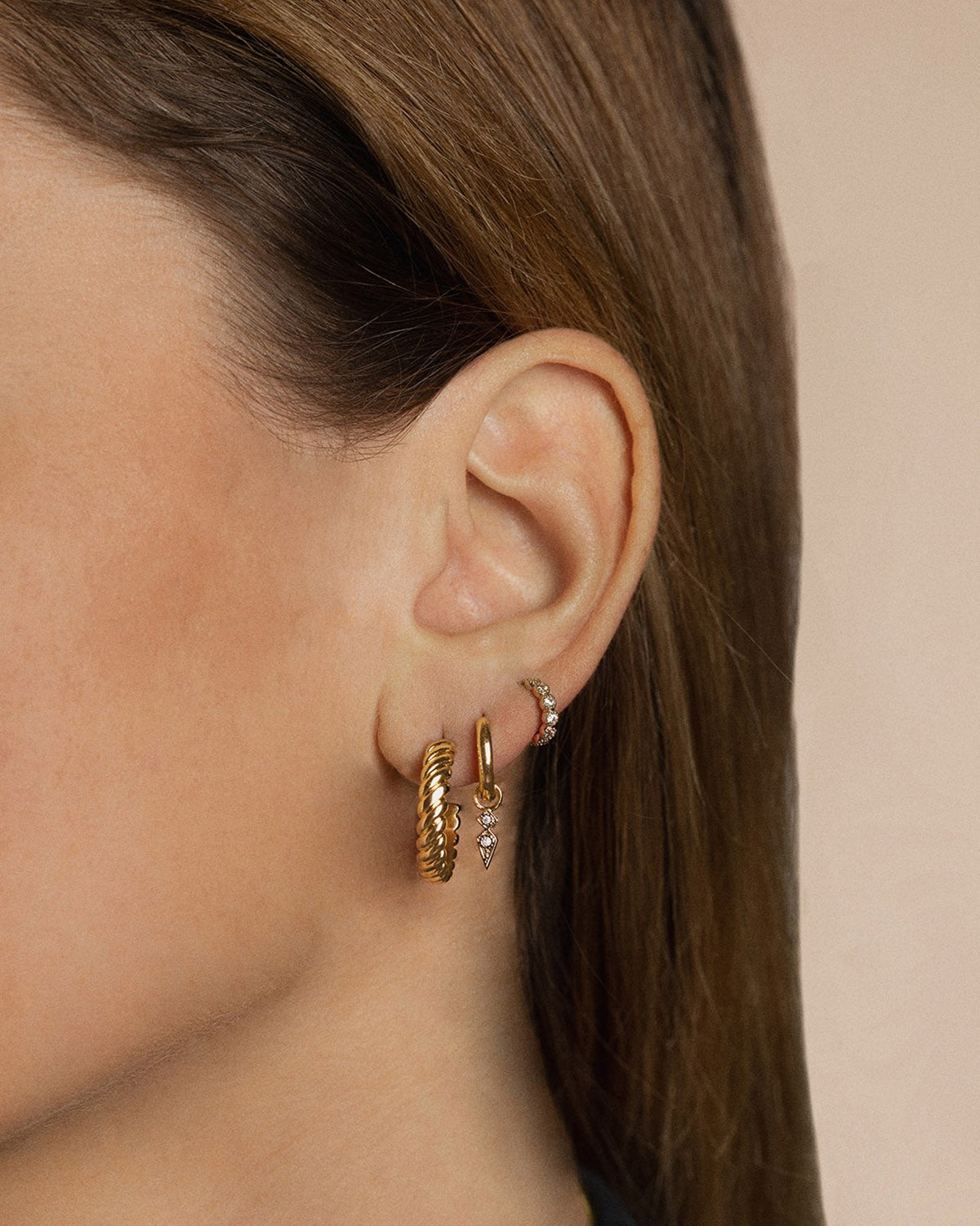 Three 18k gold-plated earrings