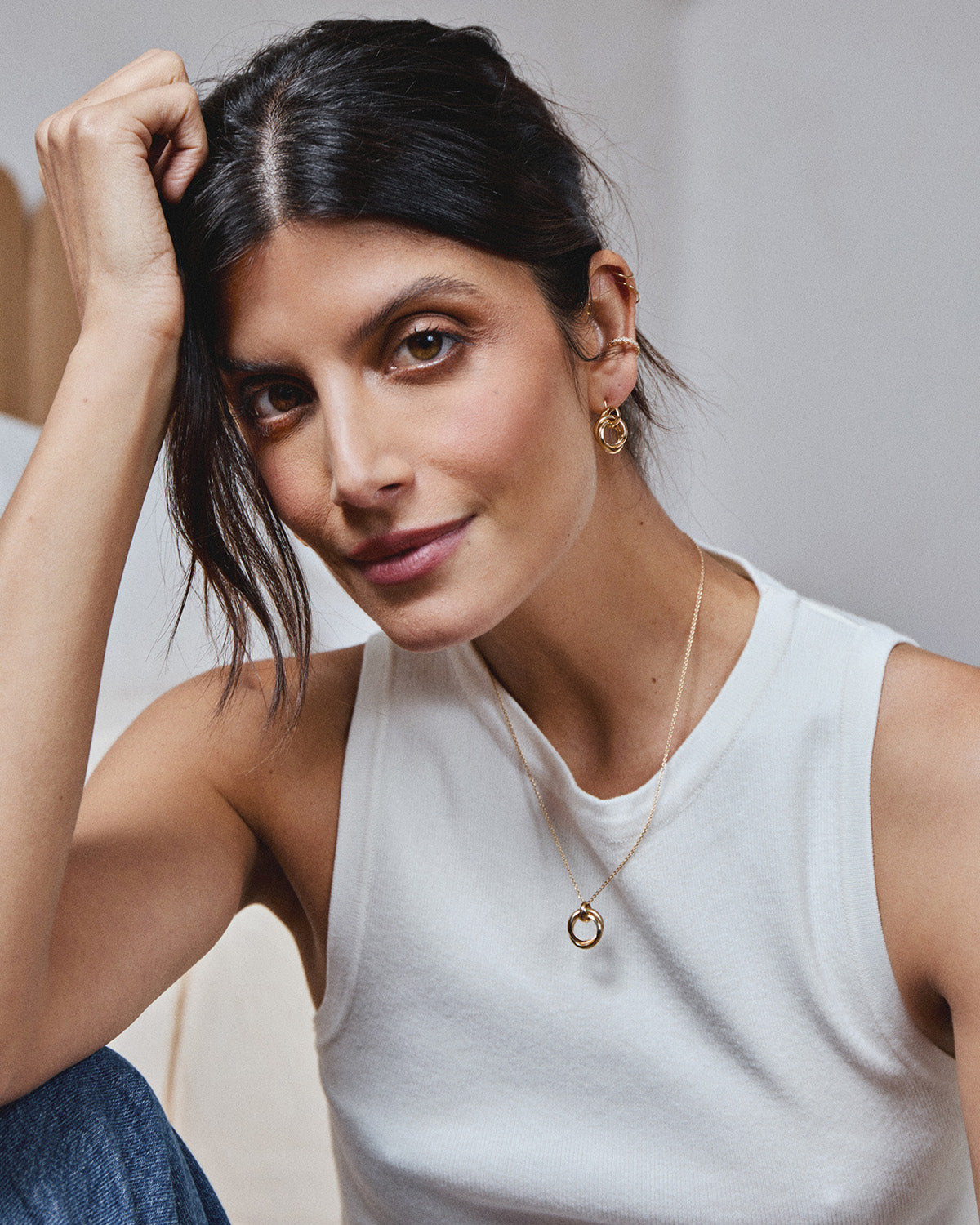 A model wearing a 18k gold-plated jewlery set