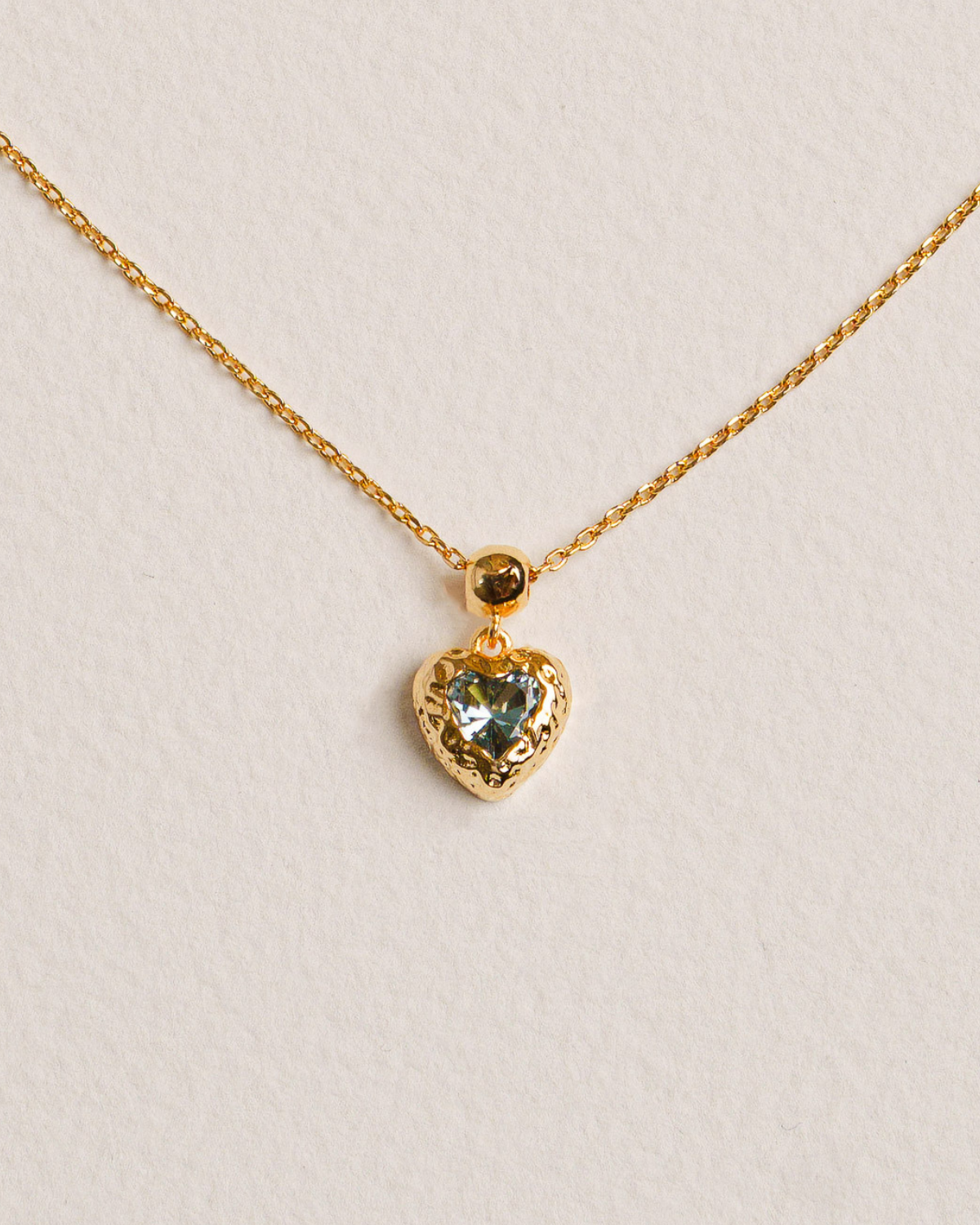 18K Gold-plated necklace with a heart-shaped pendant featuring a blue gemstone