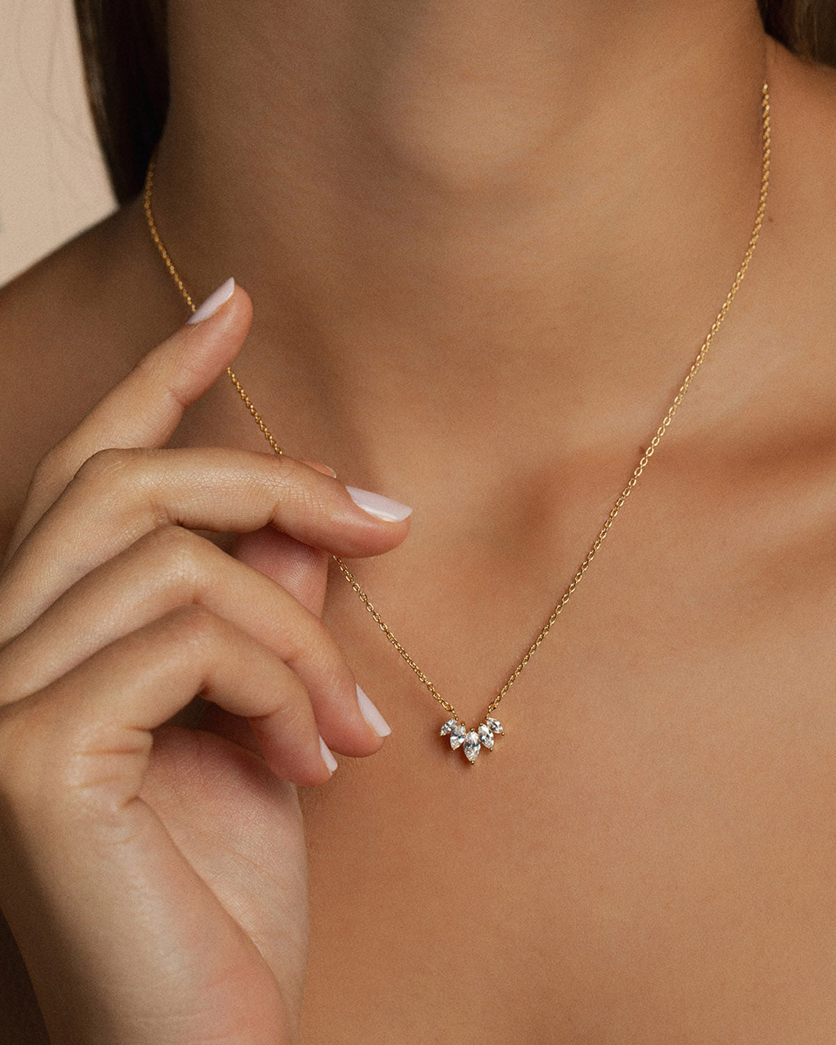 A 18k gold-plated zircon necklace worn by a model