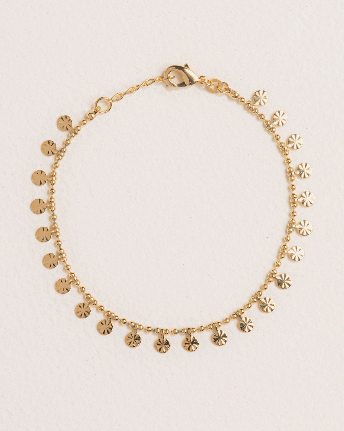 A 18k gold-plated bracelet with small beads on a chain structure - Korè Paris