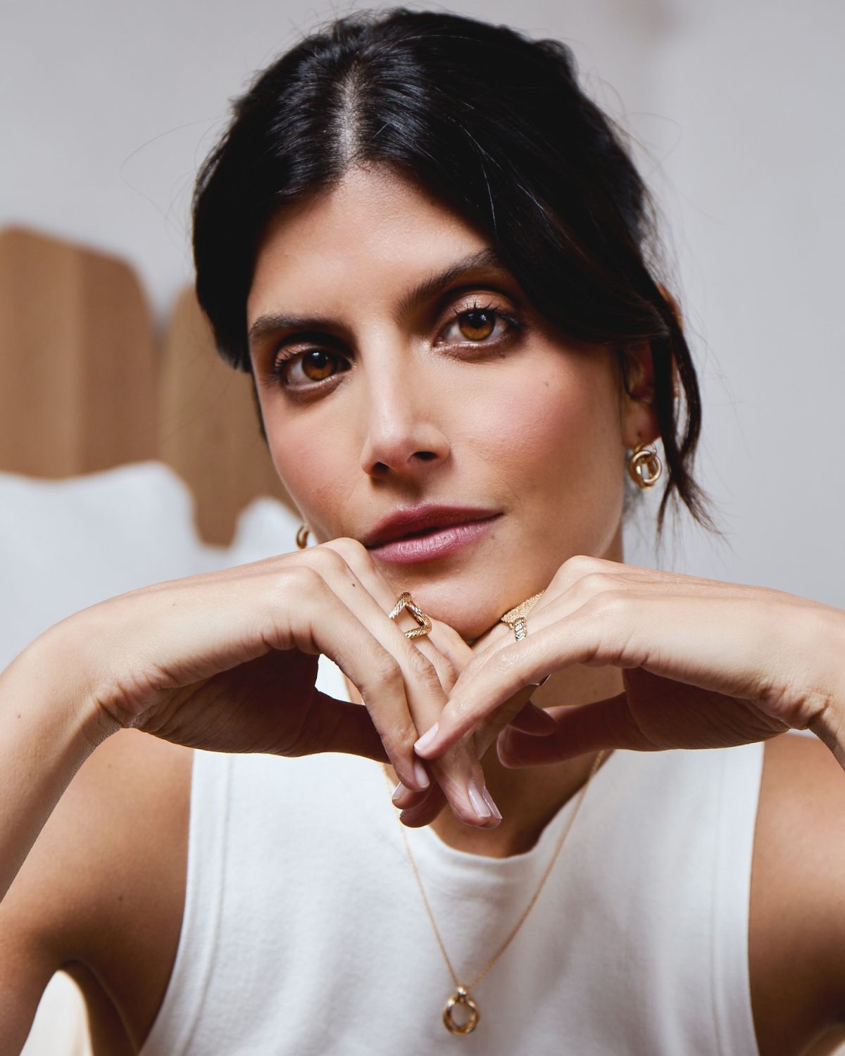 A model wearing 18k gold-plated jewelry