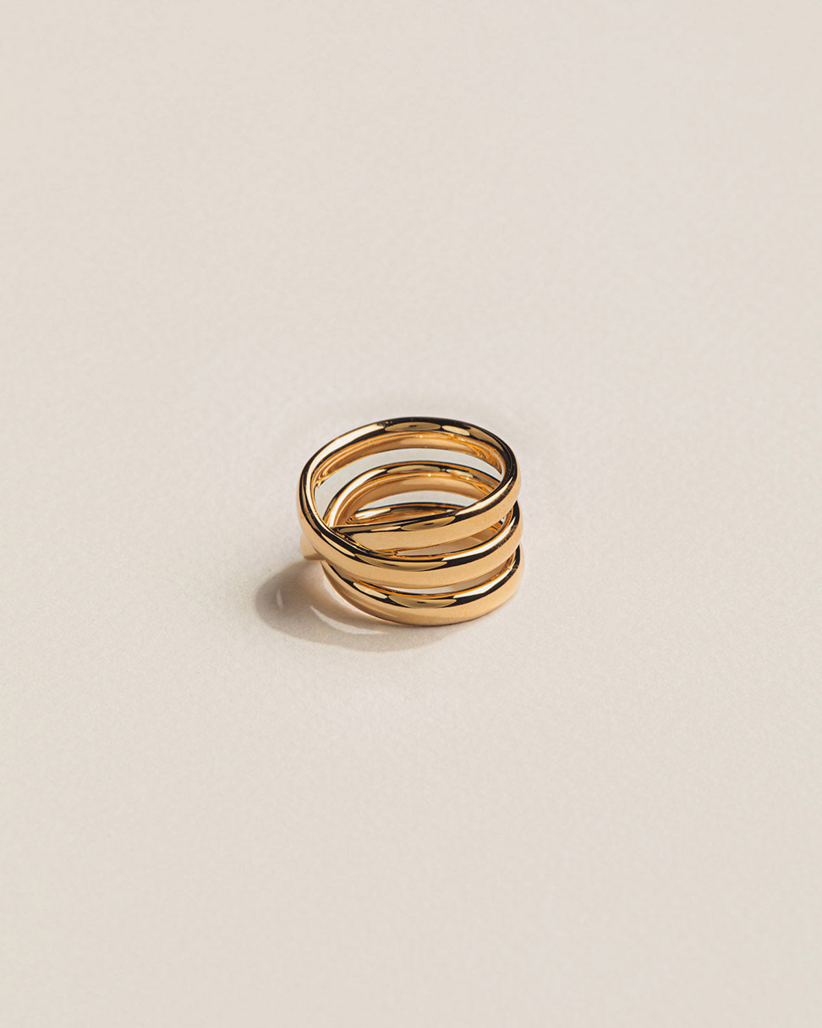 18k gold-plated ring with an organic, spiral design that wraps around the finger.