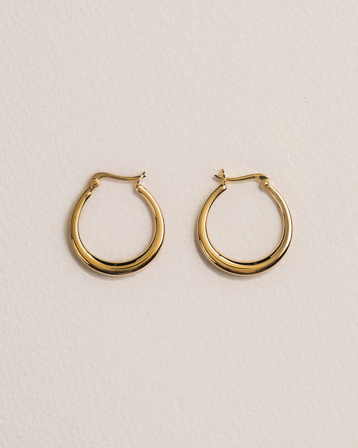 A 18k gold-plated pair of hoop earrings.